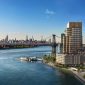 One Williamsburg Wharf rises along Brooklyn's East River, offering sweeping views of the Manhattan skyline.